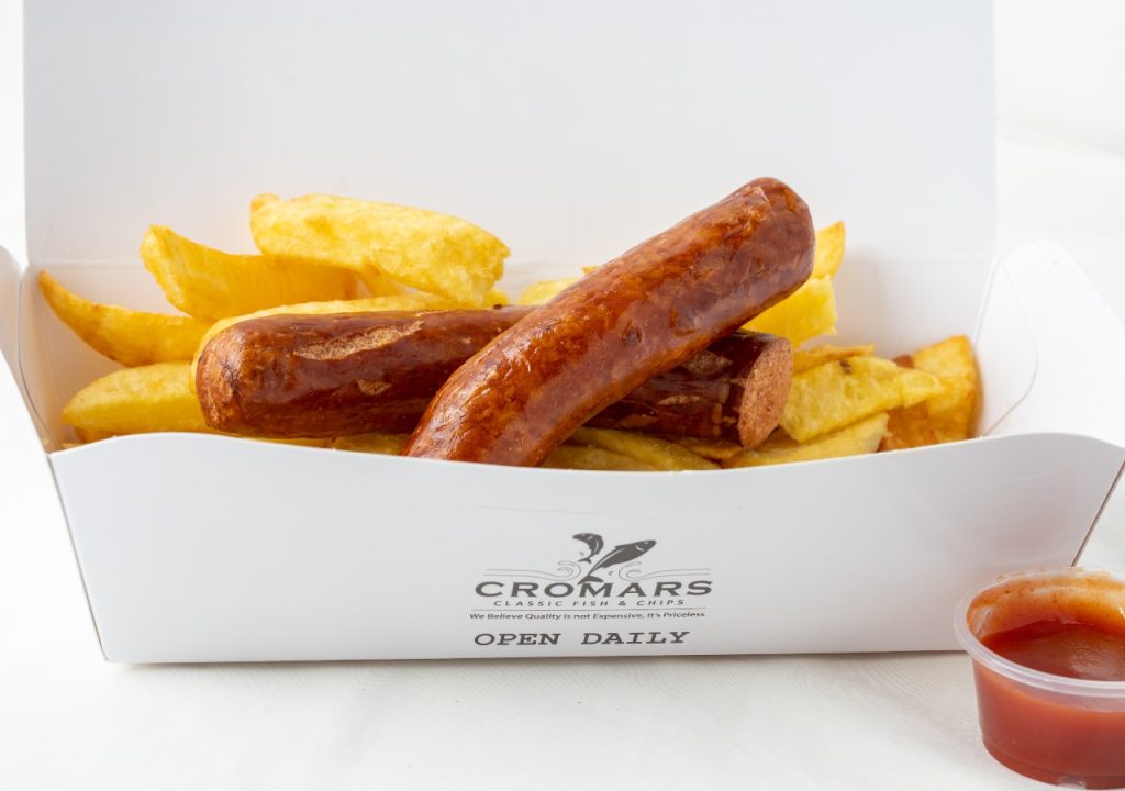 Large sausage and chips on a white background